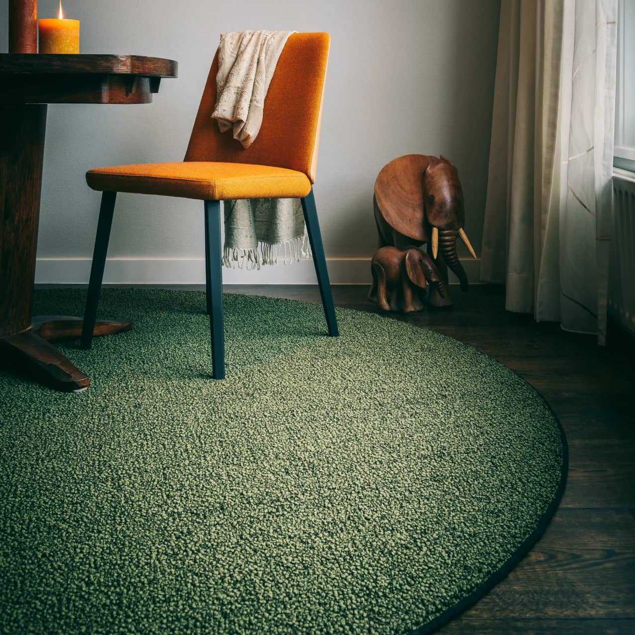 Fingers Crossed Flavoured Olive circular wool rug in dining room