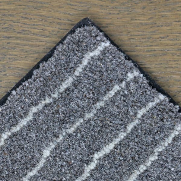 Chalk Route wool rug with blind soft black border