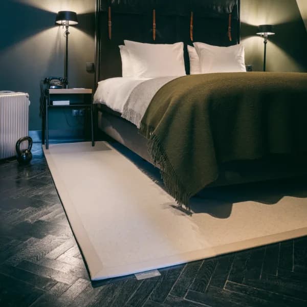 The Sweater Beach luxury wool rug in bedroom